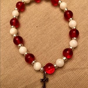 Red and white bracelet, cross
